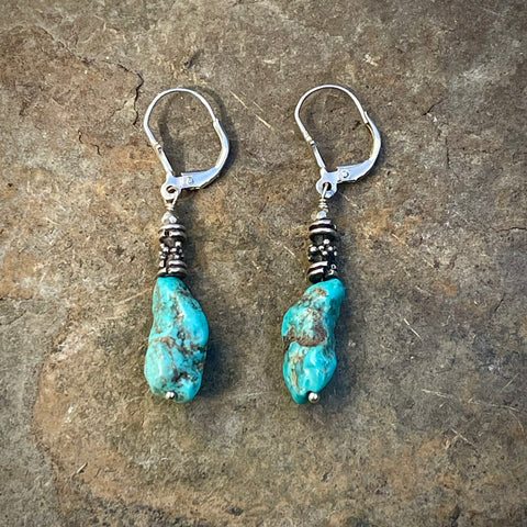 Turquoise & Thai Silver Dangle Earrings on slate stone