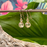 Yellow Topaz Faceted  Drop Earrings hanging on branch with green leaf background 2