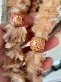 Close up ob wooden beads and yarn